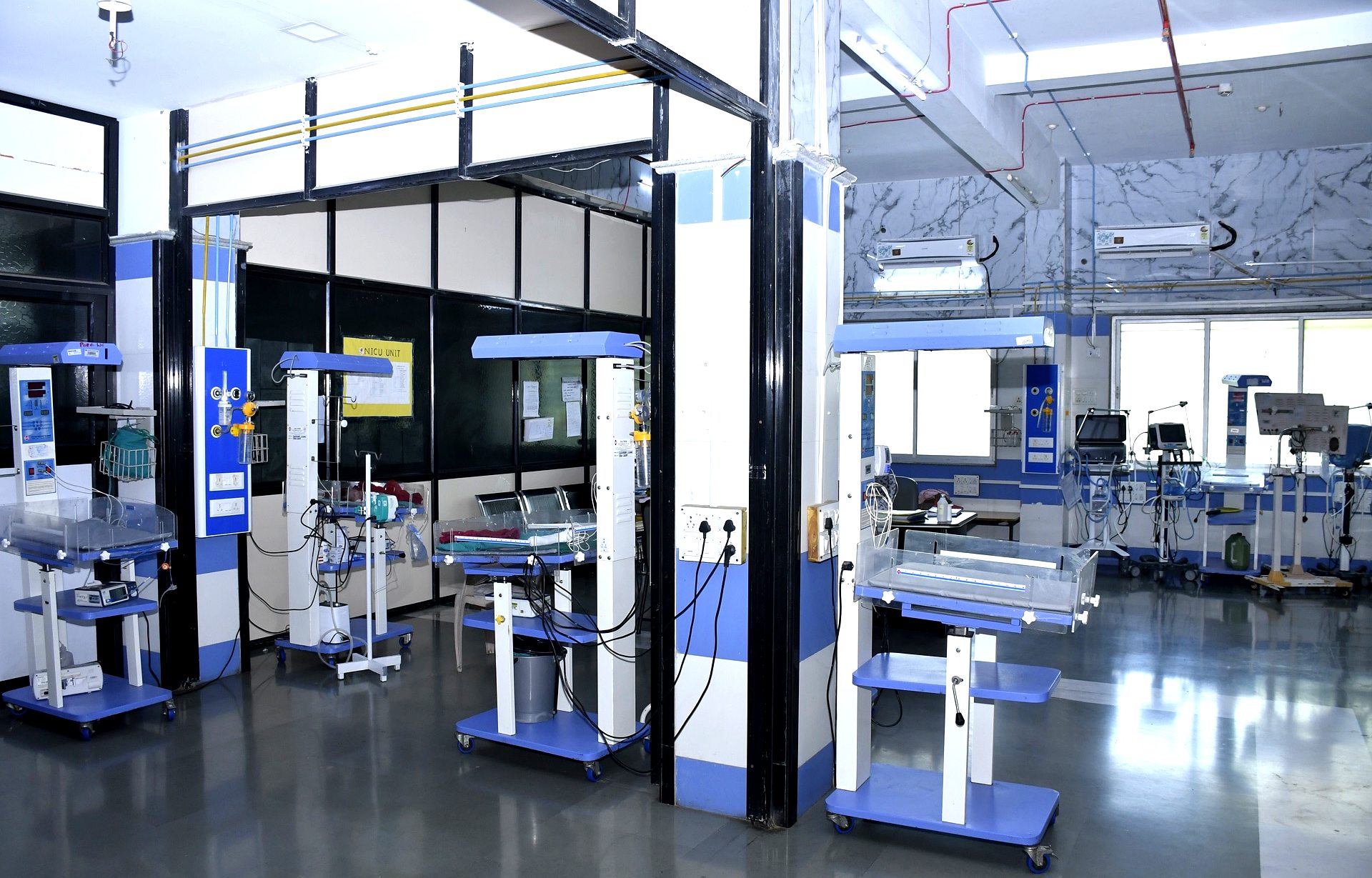 Row of dialysis machine stations with monitors and IV stands in the Nephrology department at RRSH Amravati